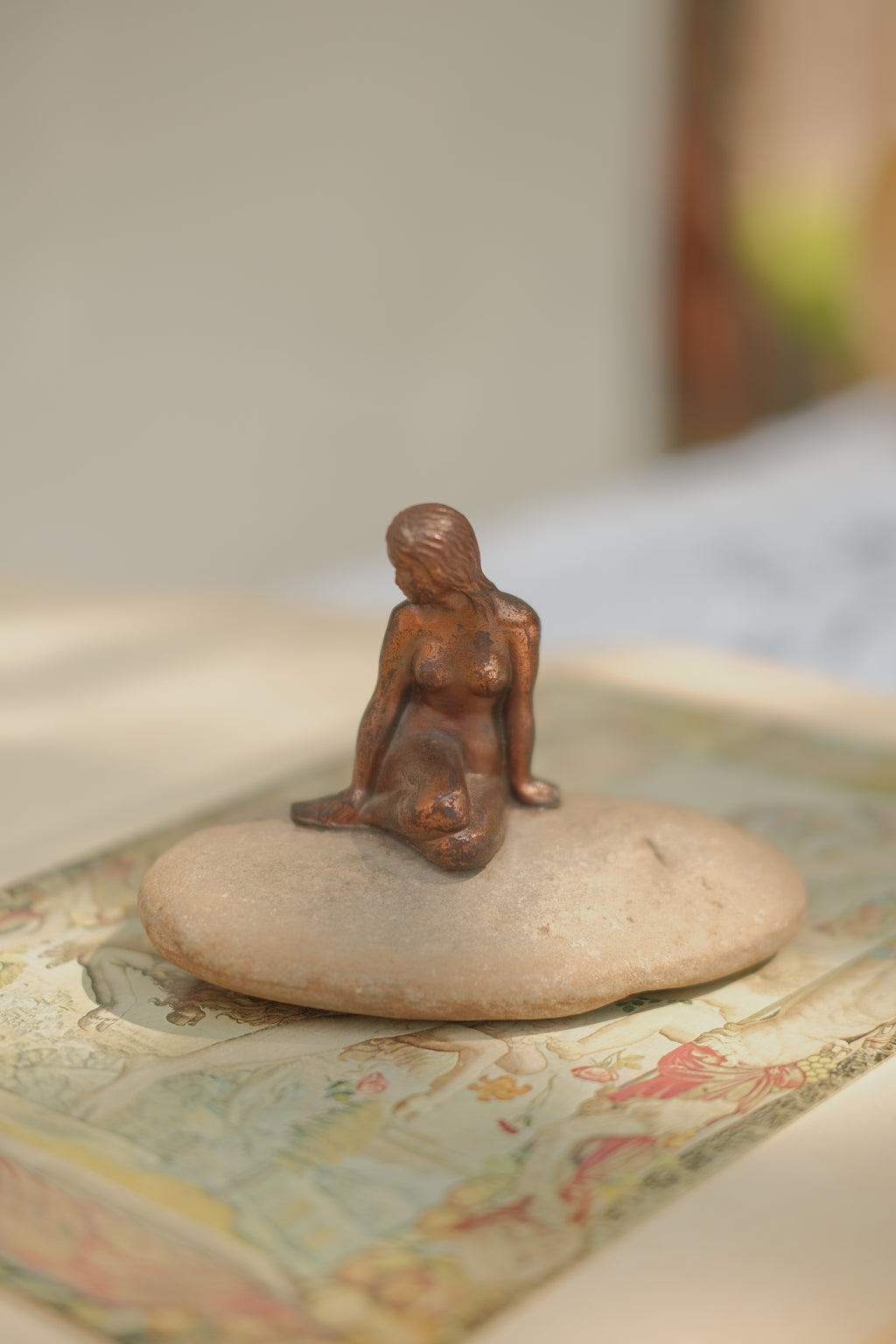 Mermaid Statue on Stone