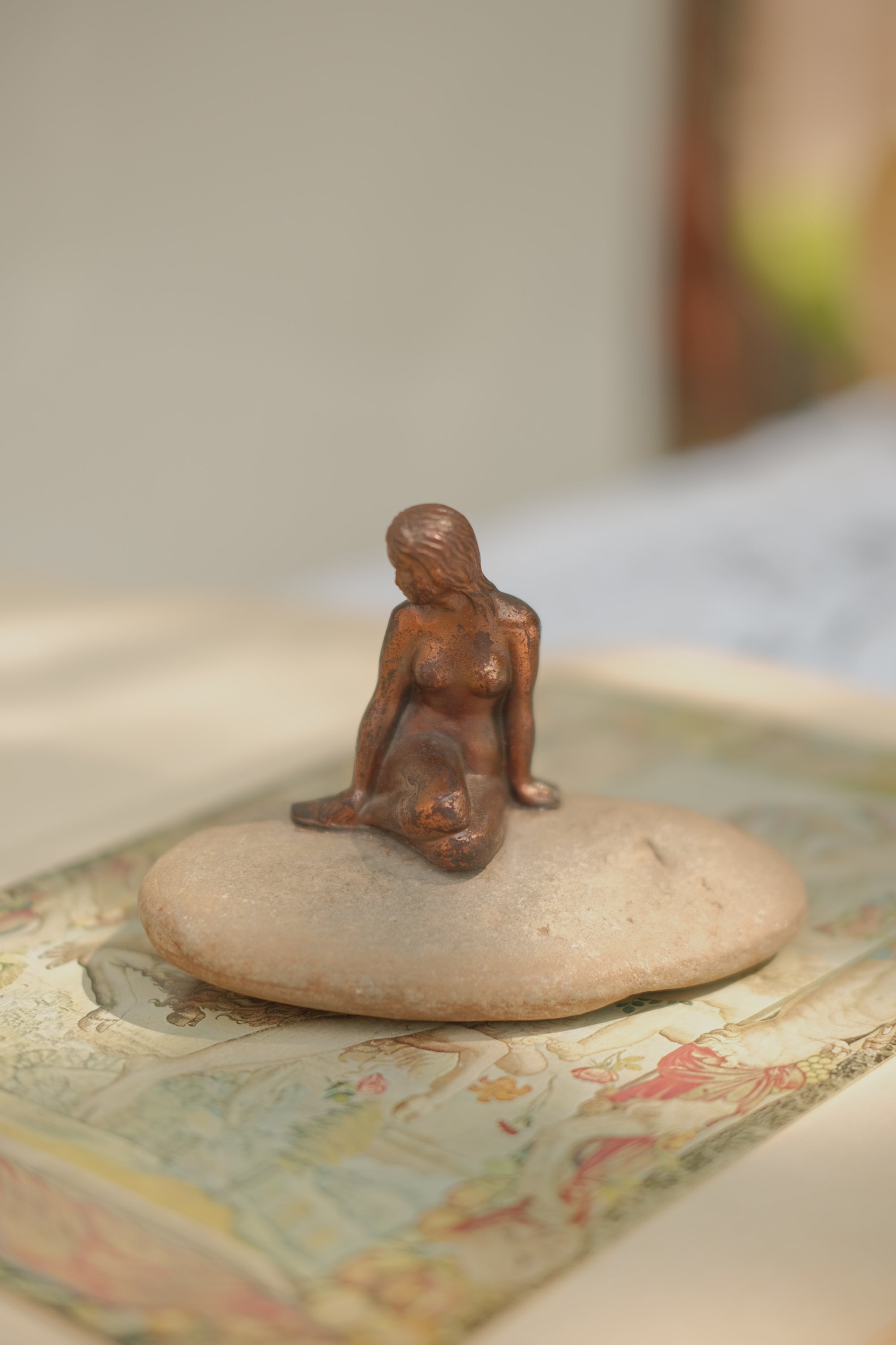 Mermaid Statue on Stone