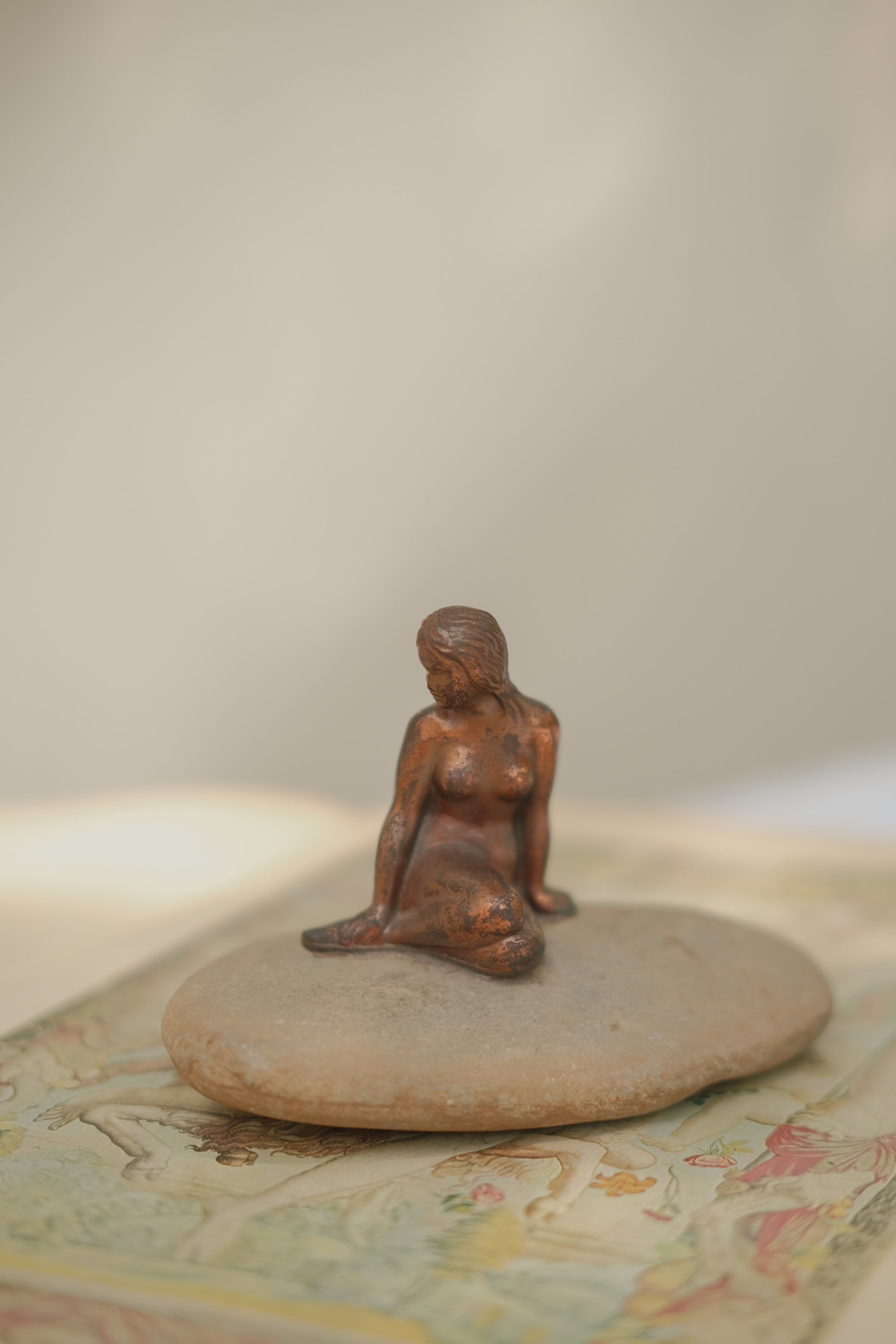 Mermaid Statue on Stone
