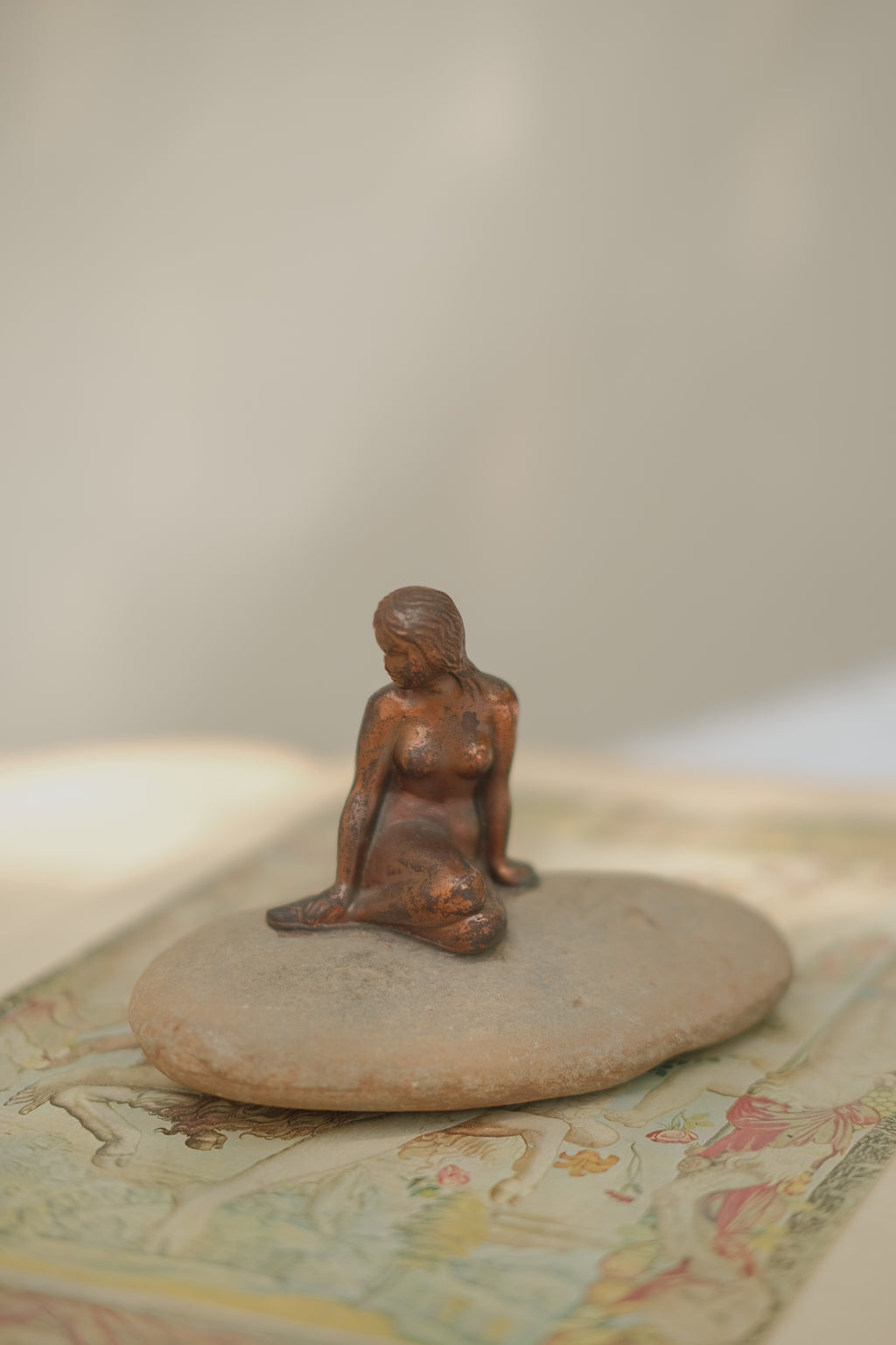 Mermaid Statue on Stone