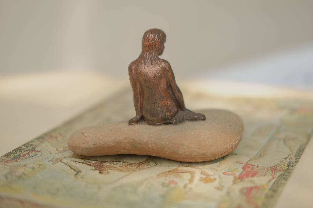 Mermaid Statue on Stone